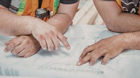 Engineers Reviewing Blueprints